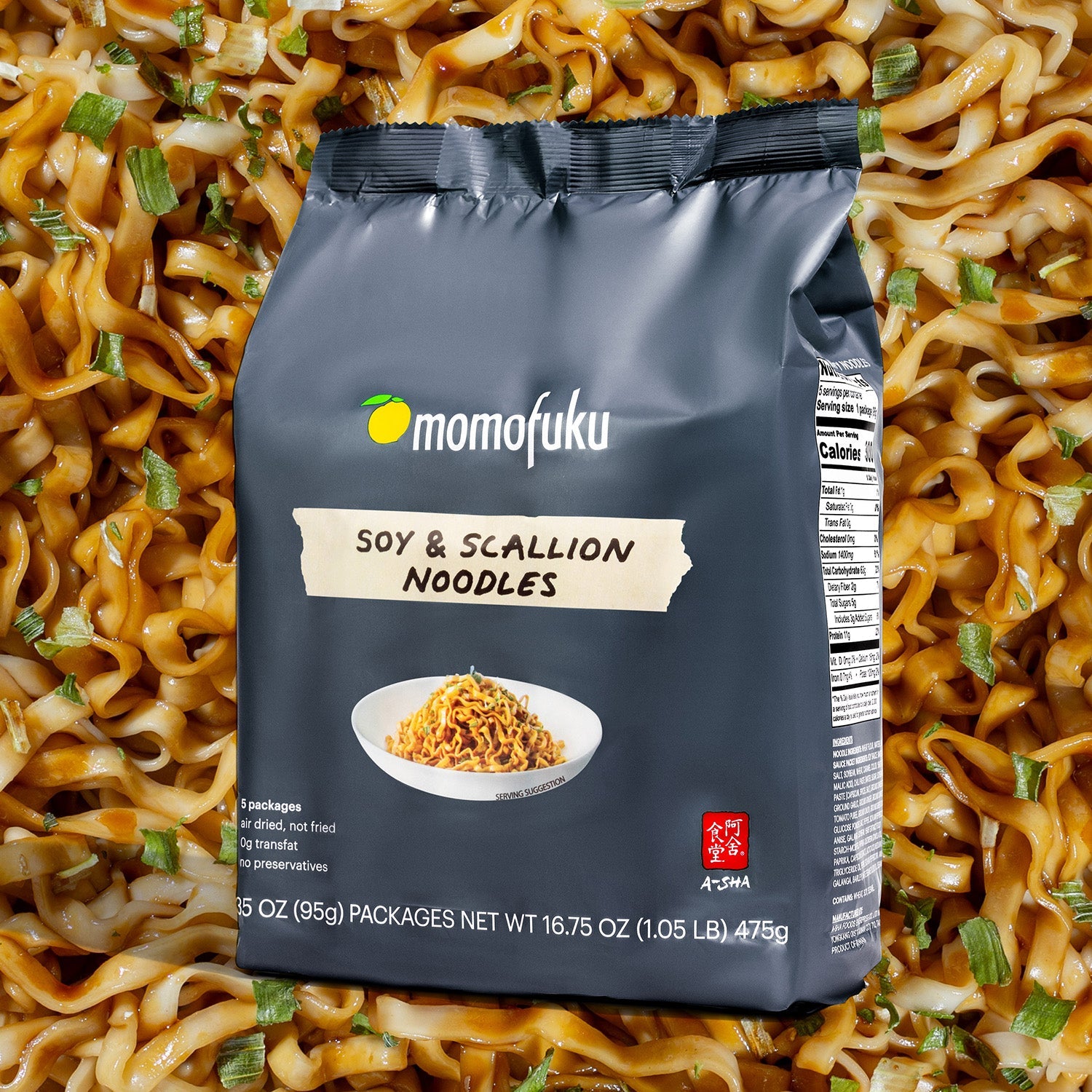 bag of soy & scallion noodles with noodle background